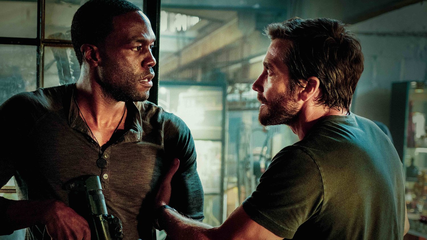 Michael Bay's "Ambulance" (2022) stars Yahya Abdul-Mateen II (left) and Jake Gyllenhaal as adopted brothers Will and Danny Sharp who together hijack an ambulance to escape police after a bungled bank heist.
